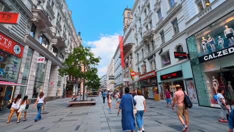 vienna, austria - june 9, 2025: shopping in vienna, austria. a tour by the peopled street with modern shops and brands