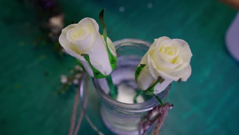 two white rose in a bottle