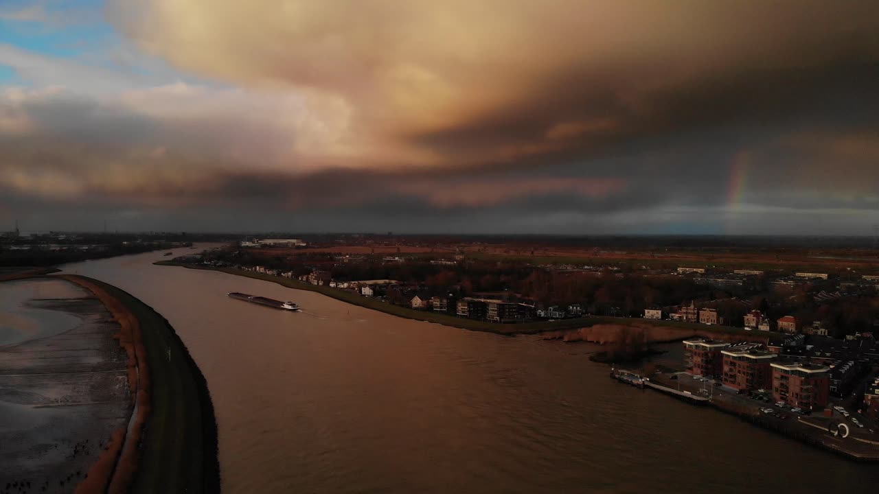 Aerial View Of Noord River With Industrial Barge Sailing At Dusk In Holland, Netherlands.