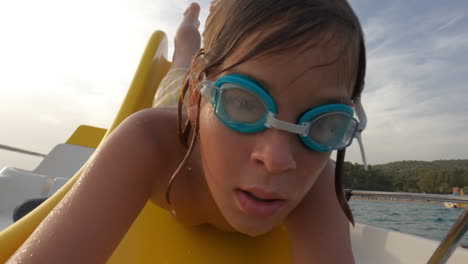 a young boy swims underwater in a pool