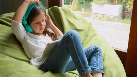 girl using digital tablet at home 4k