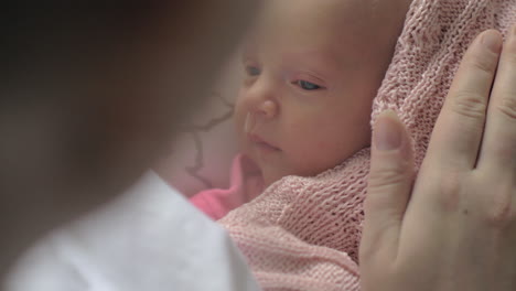 Touching-moment-of-mother-with-newborn-baby