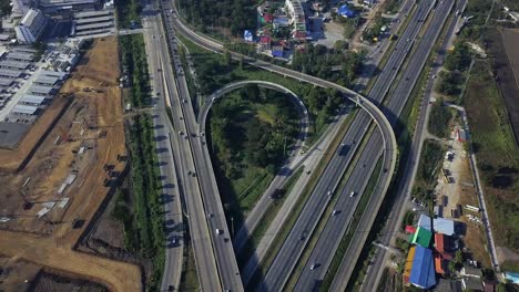 vehicles passing through busy highway in bangkok thailand - aerial shot