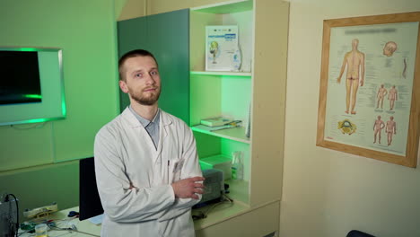 physician in white lab coat. doctor wearing white medical coat looking at camera