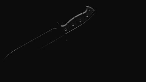 knives on the dark background and in blinking light rotate in slowmotion
