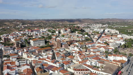 historic city of silves and the medieval castle in algarve, portugal - aerial drone shot