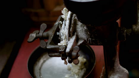 person grinding food