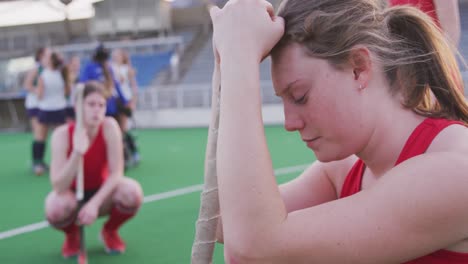 female hockey player sad after a match