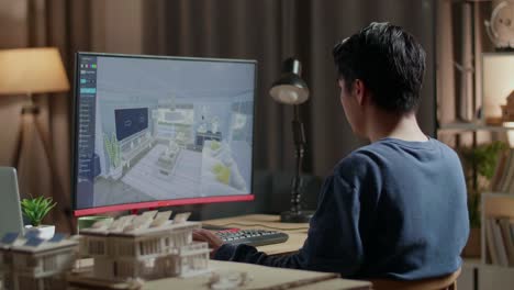 interior design student working on computer at night