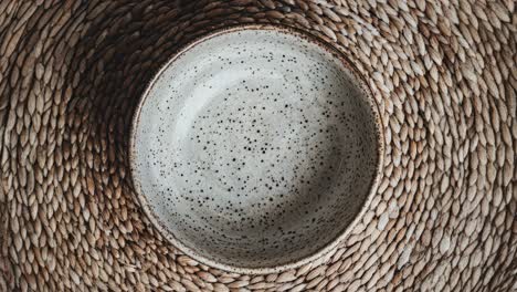 ceramic bowl on a woven mat