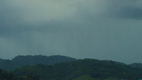 lightning striking a hill during a rainstorm