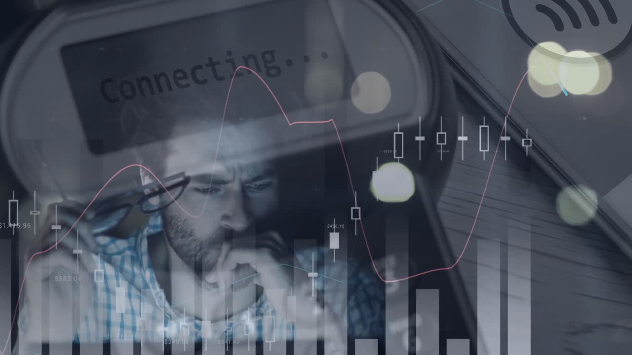 Animation of multiple graphs and connecting text in equipment, tired caucasian man working on laptop