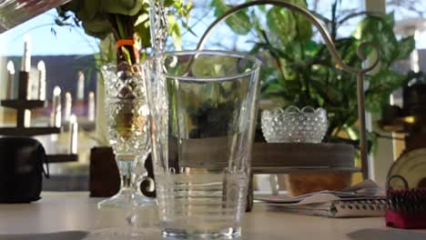 two glasses of water in slowmotion