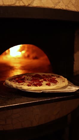 pizza baking in a wood-fired oven