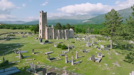 Aerial-of-old-church-and-cemetery-by-green-nature-in-Cetina,-Croatia