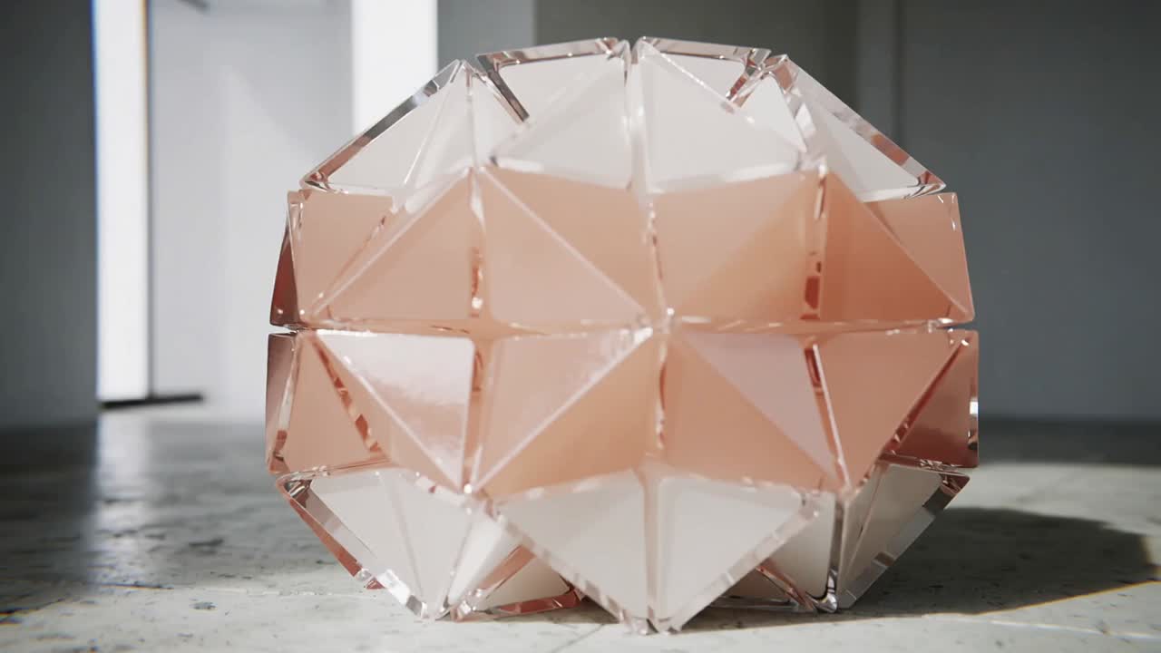 Rotating after shift faceted sculpture showing peach core on concrete floor with rod and window