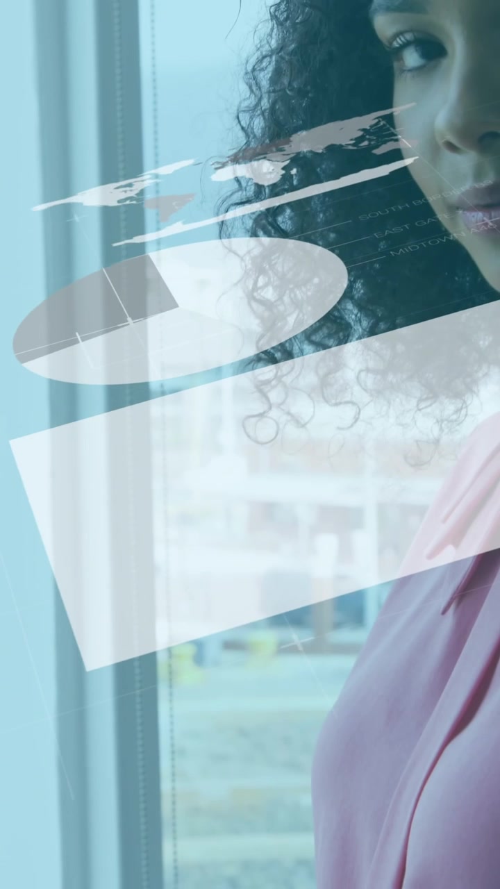 Animation of statistical data processing over happy african american woman using a laptop at office
