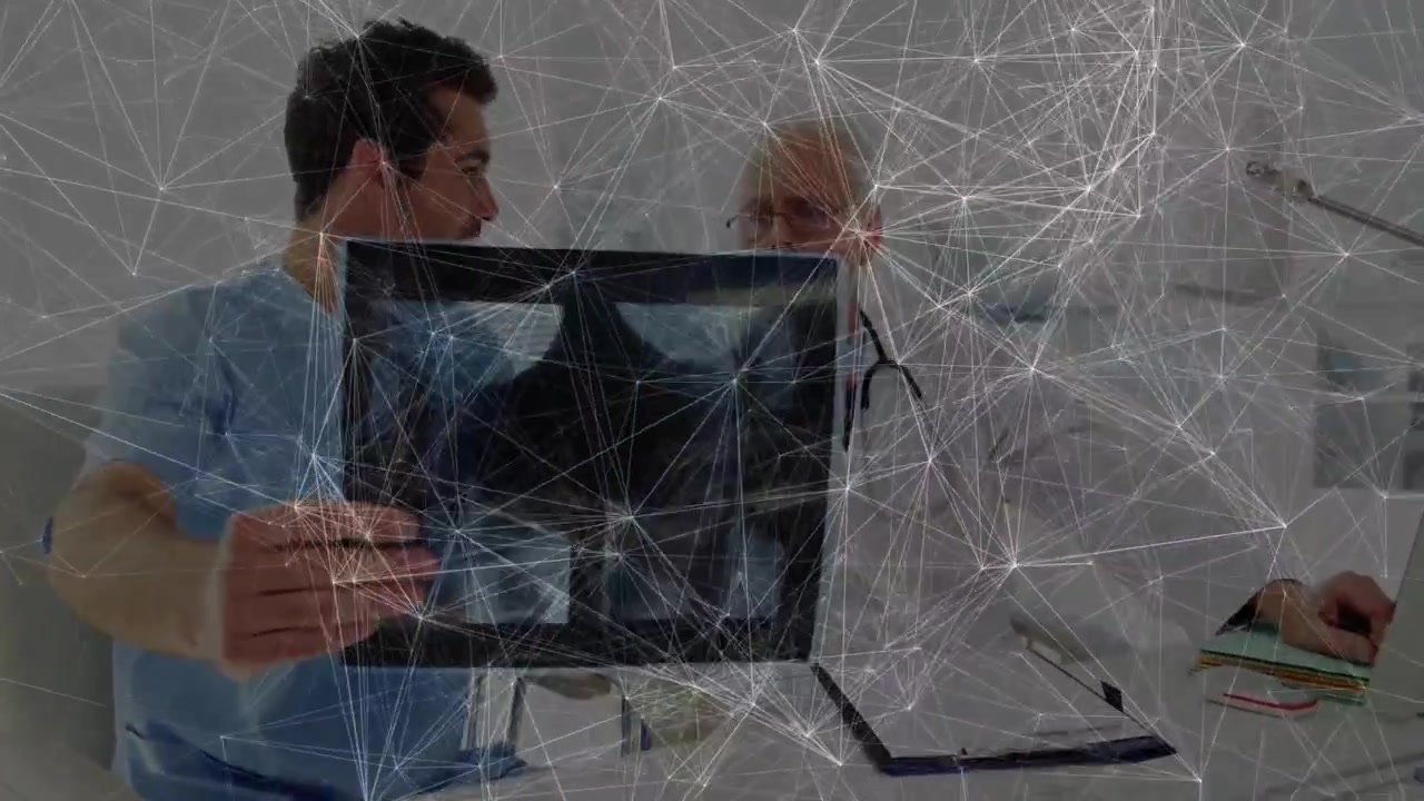 Doctors Examining X-ray Scan with Digital Network Overlay