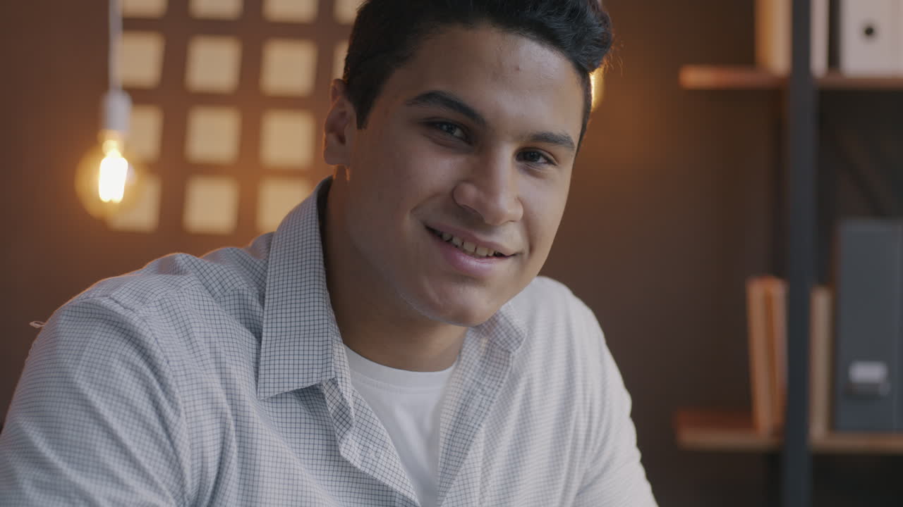 Smiling Young Man in Office