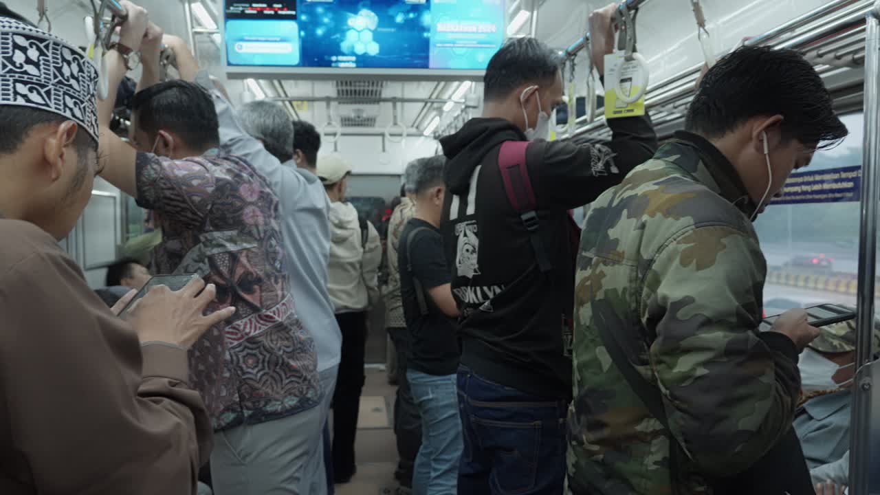 Commuters in a Crowded Train