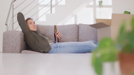 Woman-in-self-isolation-in-quarantine-during-coronavirus-pandemic-relaxing-in-her-sofa