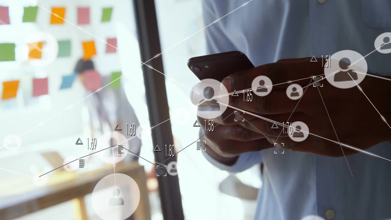 Businessman tapping phone and causing network nodes growing over glass with sticky notes for collab