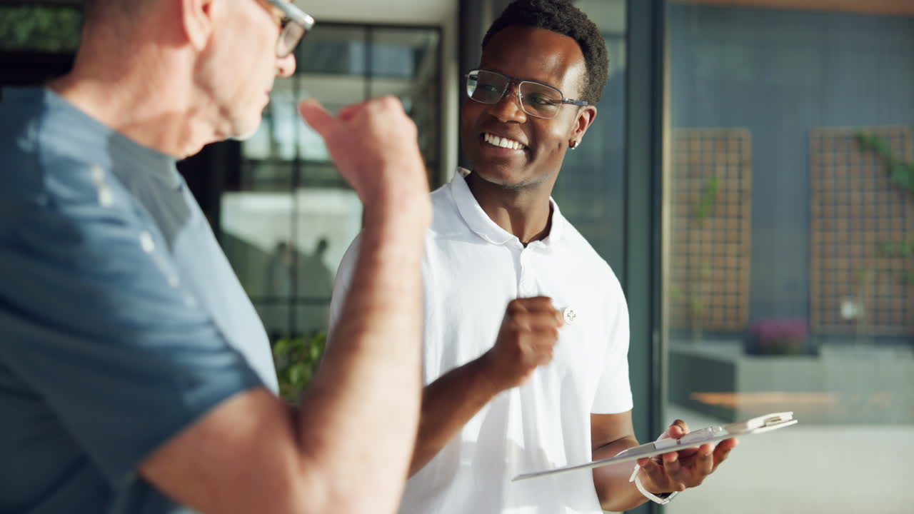 Friendly African American Man Discussing with Caucasian Client Outdoors