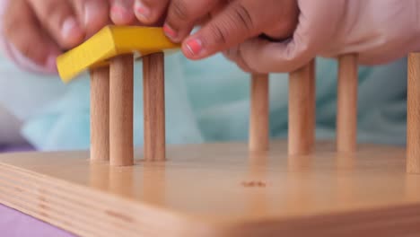 wooden peg board toy for toddlers and children