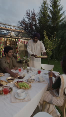 outdoor tea party and gathering in a festive garden