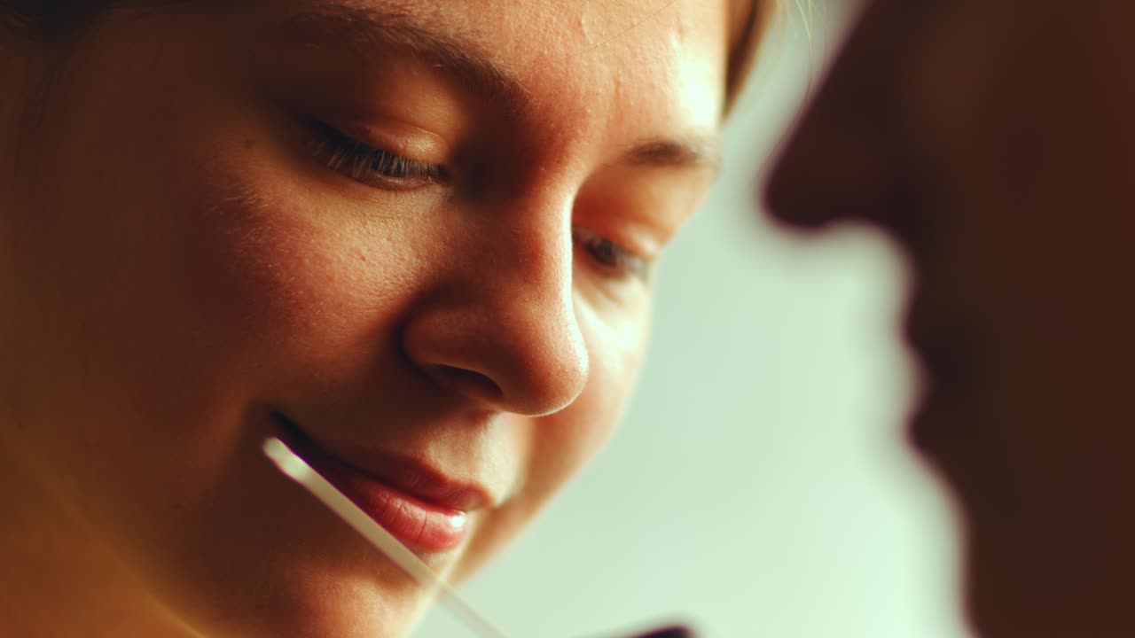 Female Tattoo Artist Doing Hand-Poked Tattoo for Girl