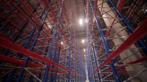 big and modern warehouse under construction, featuring metal shelving and other industrial equipment.