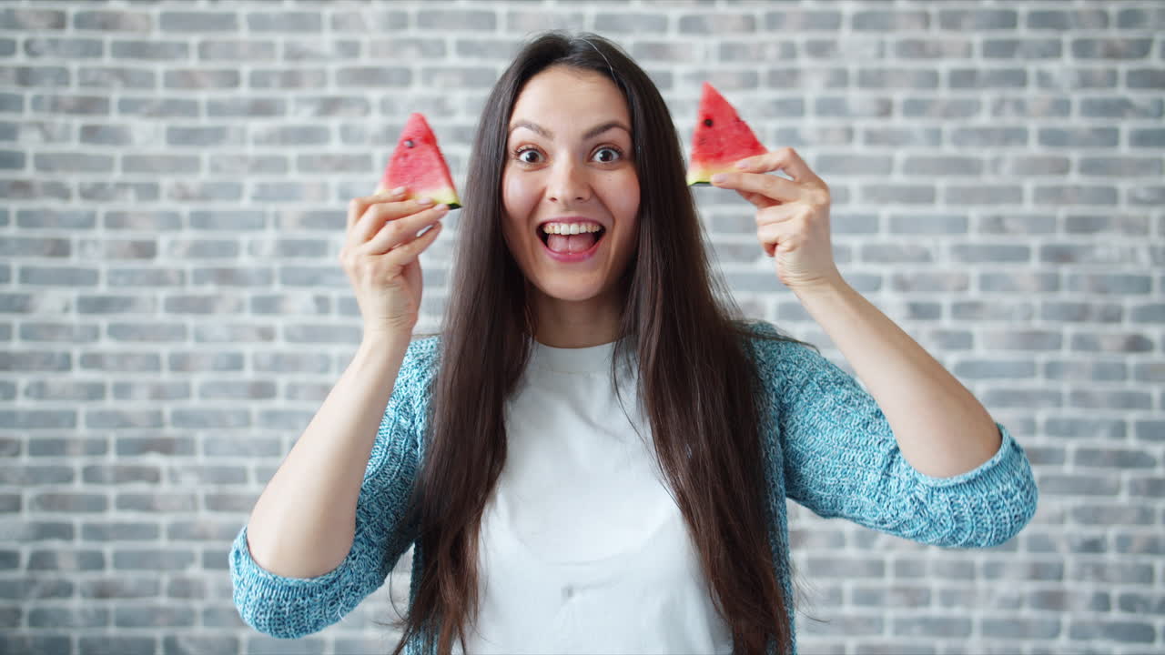 Woman Holding Watermelon Slices