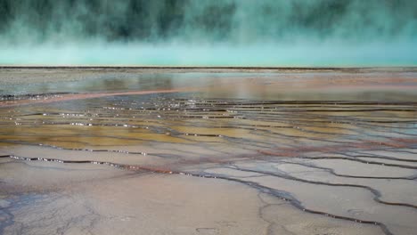 Colorful-patterns-emerge-as-the-Steaming-hot-water-and-bacteria-work-in-symbiosis-in-the-magnificent-Prismatic-Hot-Springs-in-Yellowstone-National-Park