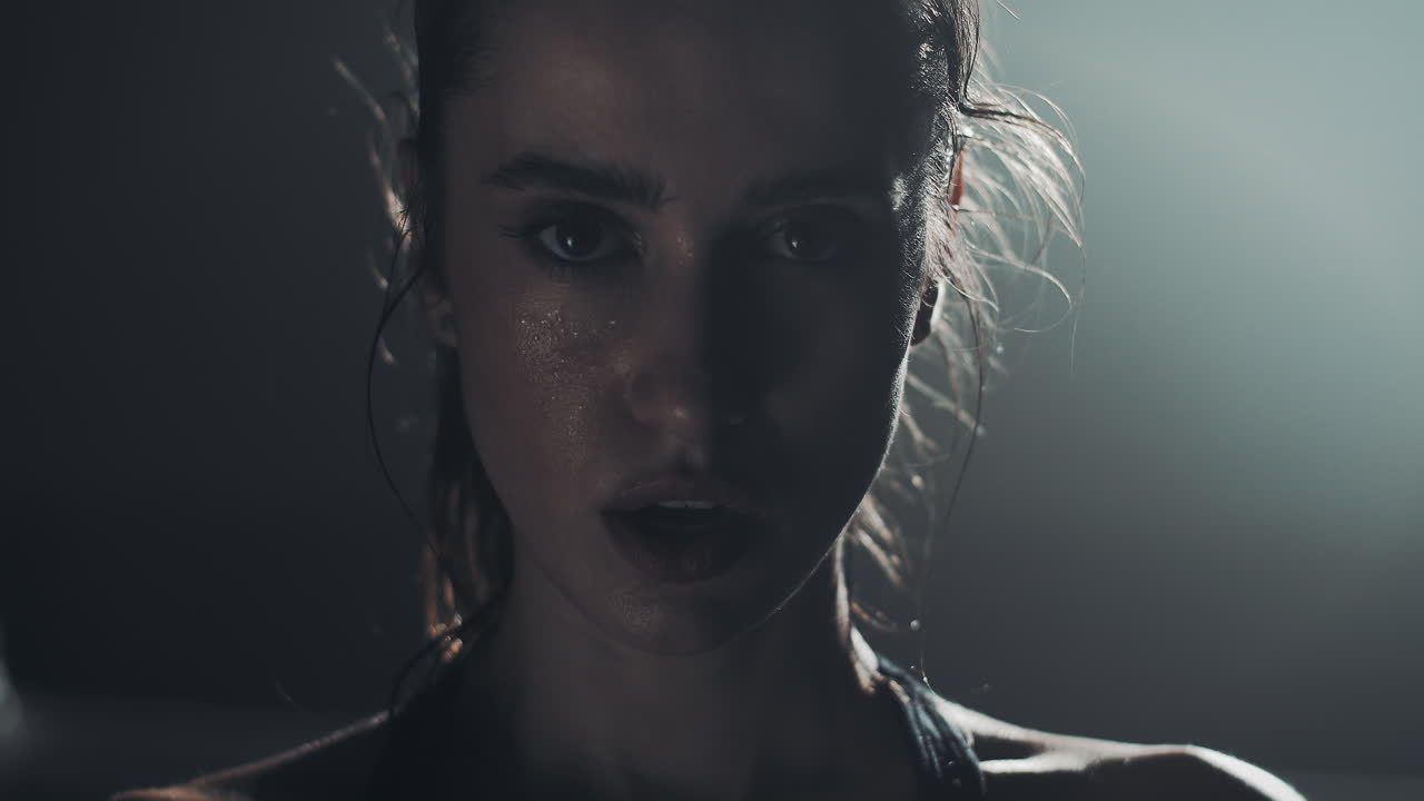 Woman with sweat on face after intense workout