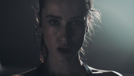 woman with sweat on face after intense workout