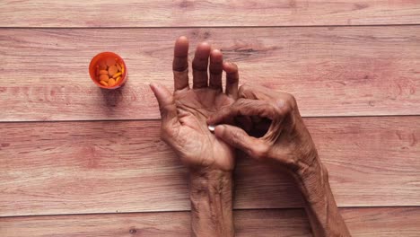 elderly person taking medication