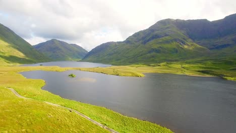 beautiful mountain range with grassland and lake 4k