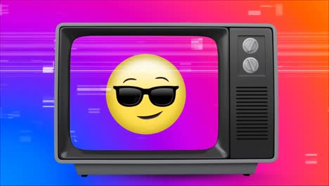 Alter-TV-Beitrag,-Der-Ein-Gelbes-Emoji-Mit-Brille-Vor-Einem-Mehrfarbigen-Hintergrund-Zeigt,-Während-Der-Fernseher-Brutzelt