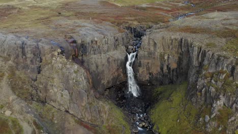 Aerial-View-Of-Fardagafoss-Waterfall-During-Autumn-In-Egilsstadir,-Iceland
