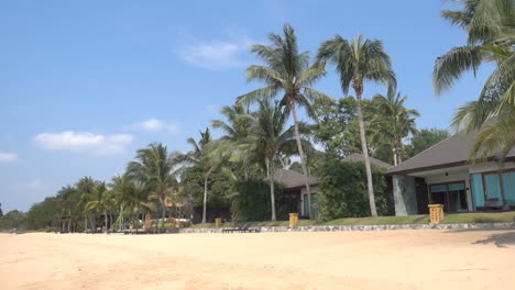 Relaxing-tropical-holidays-with-bungalows-and-hammock-on-white-beach