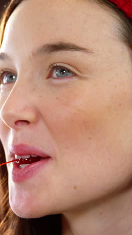 beautiful woman eating a cherry