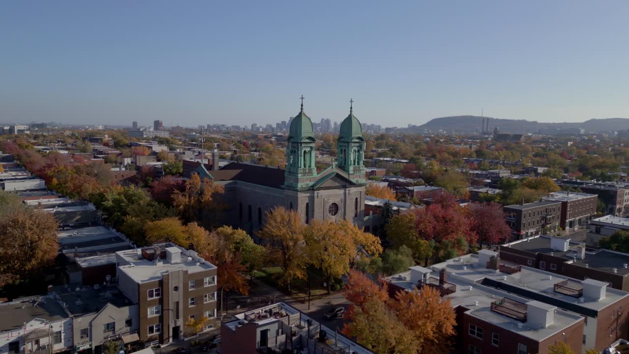 St. Mark's Catholic Church With Trees In Autumn Colors In Montreal, Quebec, Canada. - aerial shot