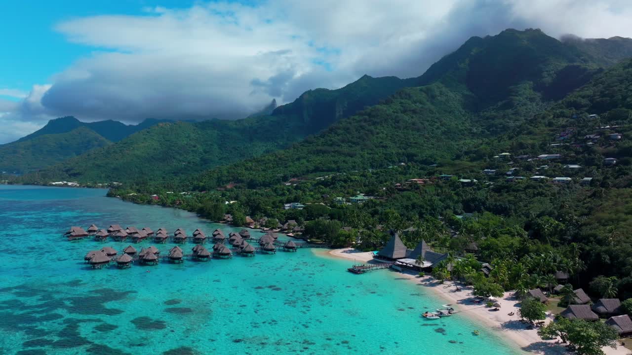 Sofitel Kia Ora Resort Moorea Toatea Lookout French Polynesia aerial drone snorkel swim turquoise bungalow blue water coral reef blue sky cloud layer mtns Tema'e Public Beach Beach circle left motion