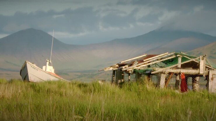Boat and Hut in Alaskan Grassland