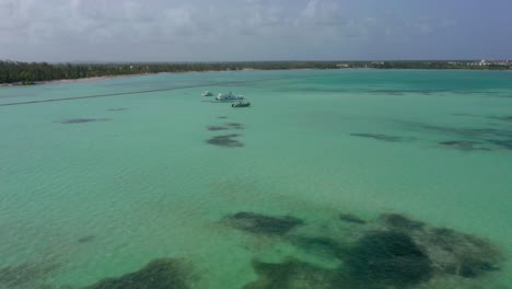 incredible large white yachts sit in incredible tropical water setting at playa juanillo dominican republic