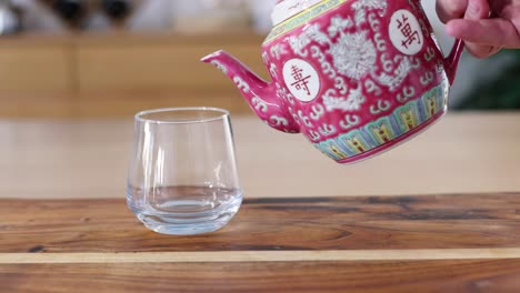 sequence of tea being poured into a clear glass