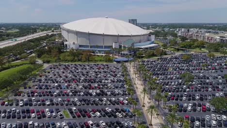 4k aerial drone video of tropicana field and full parking lot in downtown st