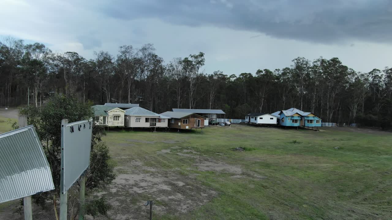 Country raised huts of Queensland countryside in Australia. Drone pov