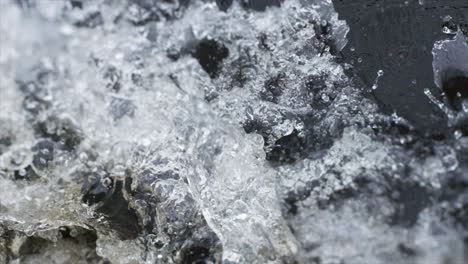 Medium-close-up-of-slow-motion-water-splashes-from-the-side-of-a-boat-cruising-down-the-Amazon-river