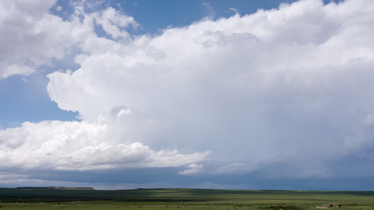 Cumulonimbus Cloud Time Lapse Over Green Fields And Hills